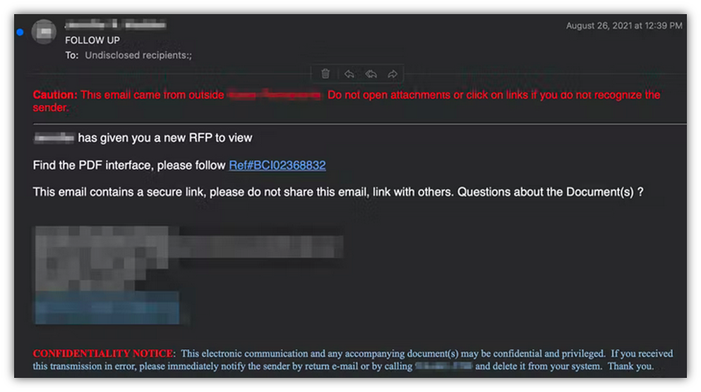 A screenshot of a phishing email with sensitive information redacted.